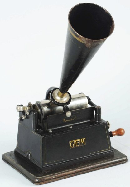 Edison Gem Phonograph.: Horn is present and belt to phonograph slips. Condition (Excellent). Size 9 - 3/4" x 7 - 1/2".