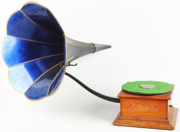 The Aretino Machine Phonograph.: Horn is present but is missing its reproducer. Piece is in very good shape. Condition (Very Good - Excellent). Size 11 - 1/2" x 11 - 1/2".