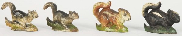 Lot of 4: Cast Iron Figural Bottle Openers.: Includes two squirrels, one chipmunk, and one skunk. Condition (Very Good). Size Largest: 2 - 1/4" T.