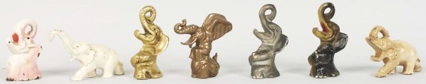 Lot of 7: Elephant Bottle Openers & Paperweight.: Includes five cast iron and two brass, including one very rare wrinkle Elephant #F-36. Condition (Excellent). Size Largest: 3 - 5/8" T.