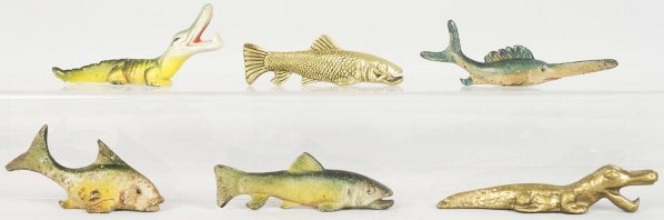 Lot of 6: Assorted Figural Bottle Openers.: Includes three fish, two alligators, and one rare Saw Fish #F-157. Four are cast iron and two brass. Condition (Very Good - Excellent). Size Largest: 2 - 3/8" T.