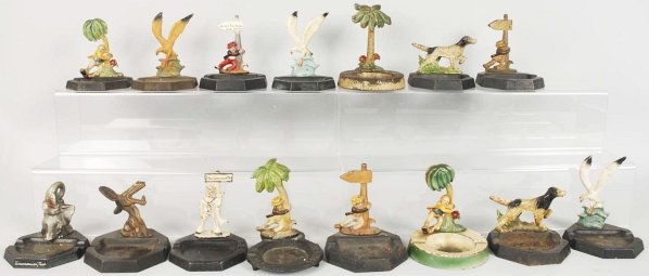 Lot of 15: Bottle Openers & Paperweights.: Includes 12 cast iron figural bottle openers and three paperweights mounted on ashtrays. Condition (Good). Size Largest: 5 - 1/4" T.