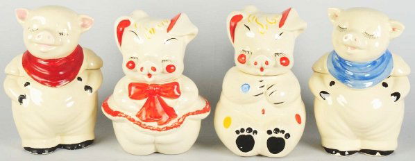 Lot of 4: Shawnee Pig Cookie Jars.: Each: 11" T. Includes a polka dot pig and three others. (Very Good - Excellent).