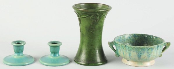 Lot of 4: Roseville Pieces.: Includes one matte green Peters & Reed vase, one pair of Carnelian candlesticks and one Carnelian II. Condition (Very Good). Size Largest: 7 - 1/2" T.