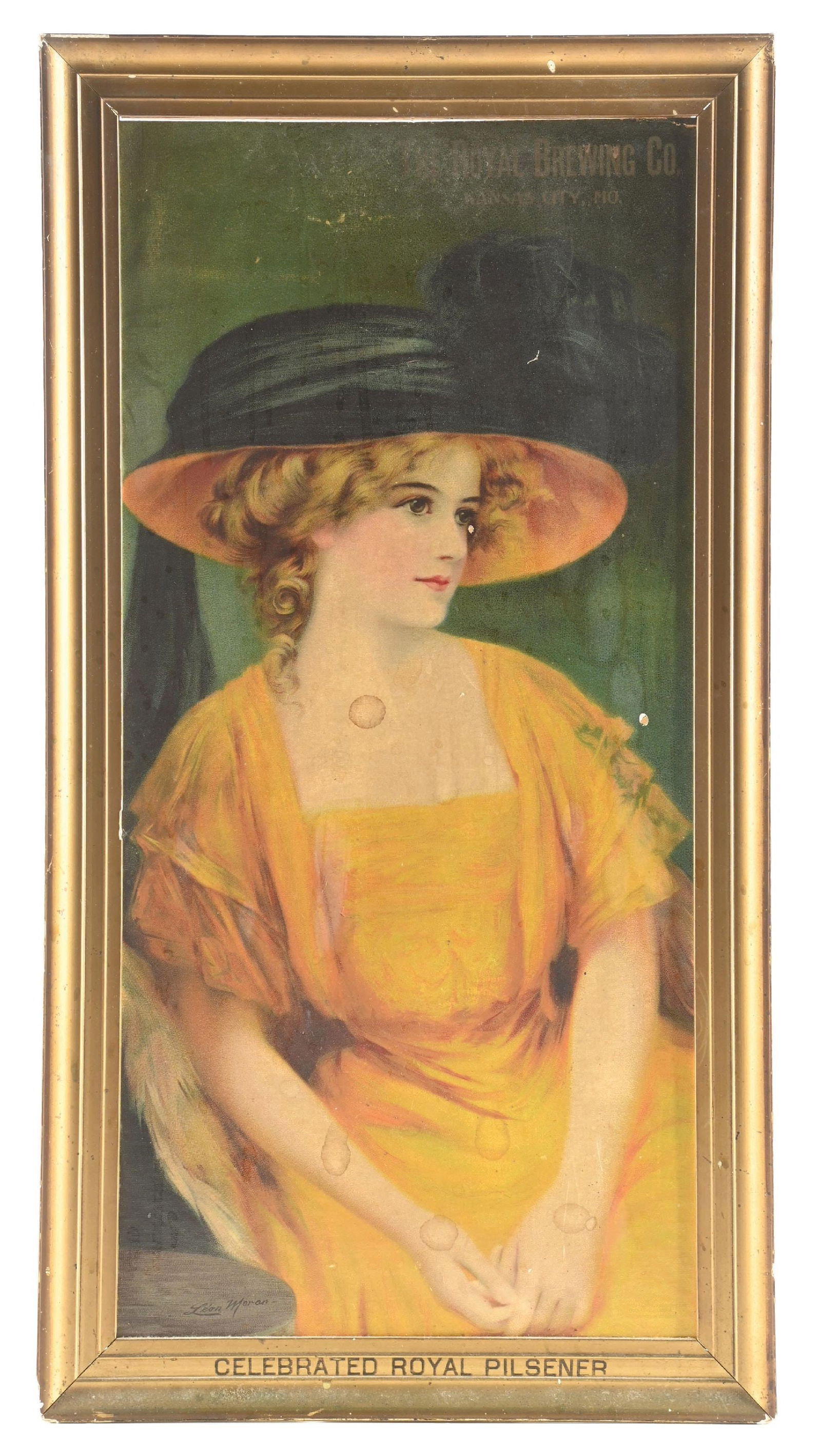 THE ROYAL BREWING CO. PILSNER SIGN W/ WOMAN GRAPHIC LITHOGRAPH: This C. early 1900s to 1910s cardboard lithograph sign from the Royal Brewing Company - Kansas City, MO features a wonderful graphic of well-clad woman. Artist marked "Leon Moran" in the bottom left c