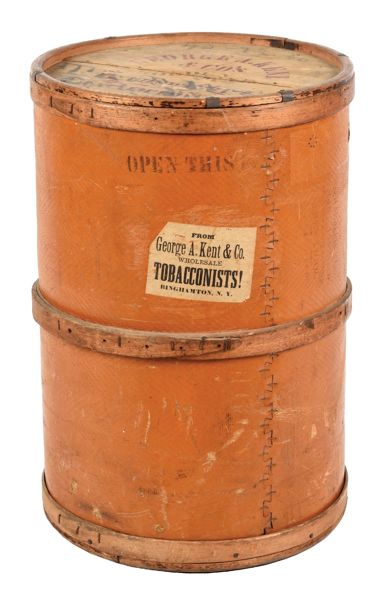 GEORGE A. KENT & CO. WOODEN BARREL: This wooden barrel was from the George A. Kent Company, who were wholesale tobacconists out of Binghamton, New York. CONDITION: There are areas of wear, with applied stenciling to the front lid and an