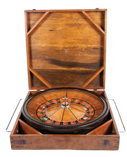 ROULETTE WHEEL IN ORIGINAL WOODEN CASE: C. 1928. CONDITION: Original full-size roulette wheel in the original shipping crate. Walnut and mixed woods construction, with light wear from use. The original crate shows wear from handling and has