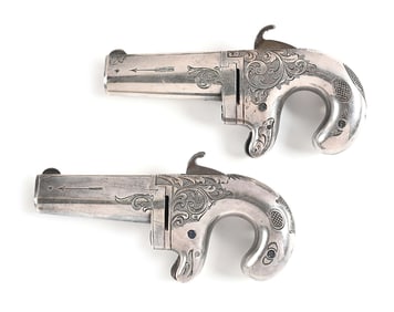 (A) CASED PAIR OF MOORE'S AND NATIONAL ARMS CO. DERRINGERS.