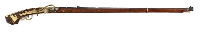 (A) ELABORATE JAPANESE TANEGASHIMA MATCHLOCK RIFLE WITH SAMURAI THEMED DECORATIONS.