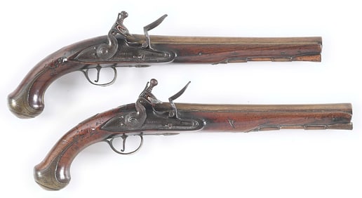 (A) MASSIVE PAIR OF BRASS BARRELED BRITISH OFFICERS PISTOLS BY WATERS.