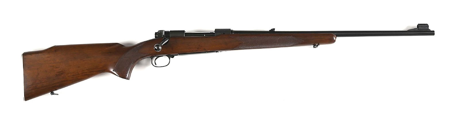 (C) PRE-64 WINCHESTER MODEL 70 FEATHERWEIGHT .30-06 BOLT ACTION RIFLE: Manufactured in 1957. Bolt has matching etched serial number. Features blue finish, hooded ramp front sight, folding leaf rear sight, alloy butt plate, walnut stock, checkered, pistol grip, Monte Carl