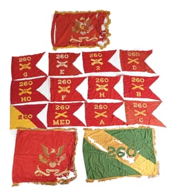 LARGE LOT OF 260TH COAST ARTILLERY BATTALION GUIDON AND REGIMENTAL FLAGS.