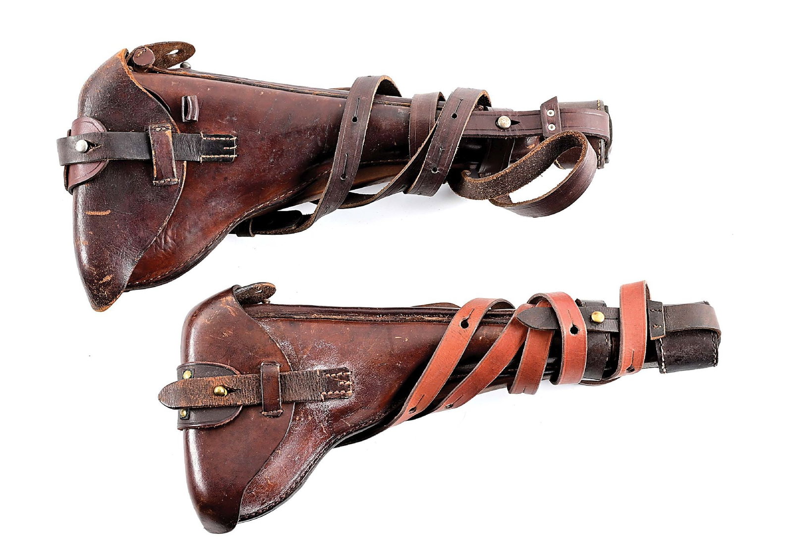 LOT OF 2: ARTILLERY LUGER HOLSTERS WITH STOCKS.: Lot consists of (A) Artillery luger holster and stock. Straps and Iron boot are modern reproductions. (B) Artillery luger holster and stock. Straps and Iron boot are modern reproductions. CONDITION: V