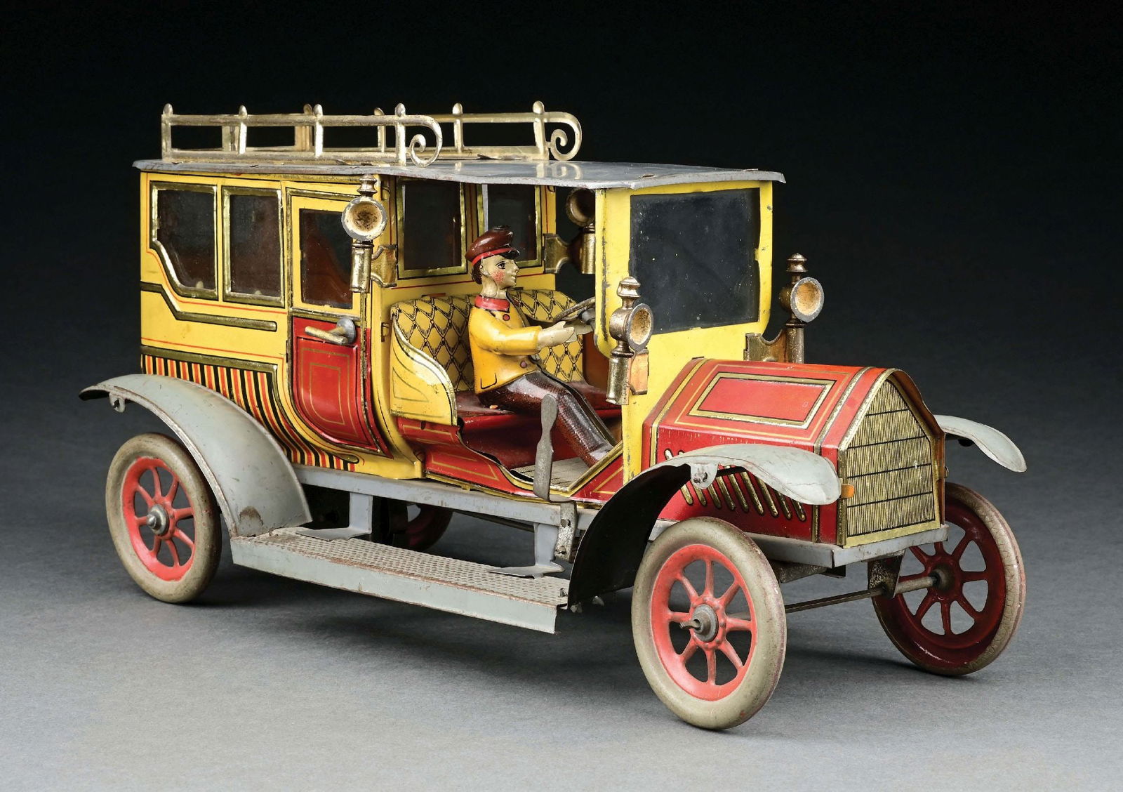 HANS EBERL TIN LITHO CLOCKWORK LIMOUSINE: CONDITION: Retains original driver and lamps. Fenders and roof are excellent condition, lithographed body is excellent to near mint condition. Item Dimensions: 14" x 6" x 7 - 1/2".