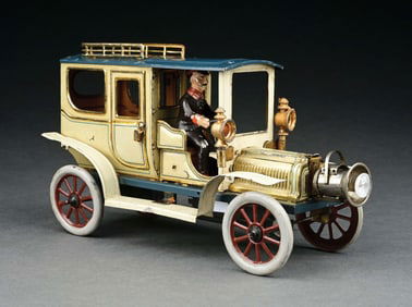 CARETTE TIN LITHO CLOCKWORK-POWERED LIMOUSINE W/ BATTERY-OPERATED HEADLIGHT
