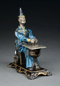 SCARCE VERSION GERMAN CAST IRON SANDT CLOWN AT SEWING MACHINE TABLE
