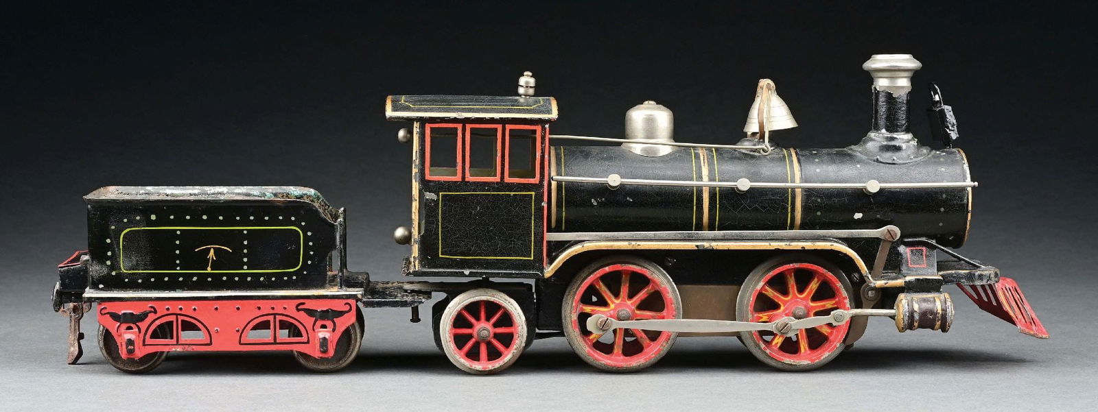 MARKLIN I-GA. HAND-PAINTED 0-4-2 LOCOMOTIVE & TENDER: C. 1903. CONDITION: Excellent. Replaced headlamp. Includes key crank. Item Dimensions: Largest: 13" x 3" x 5".