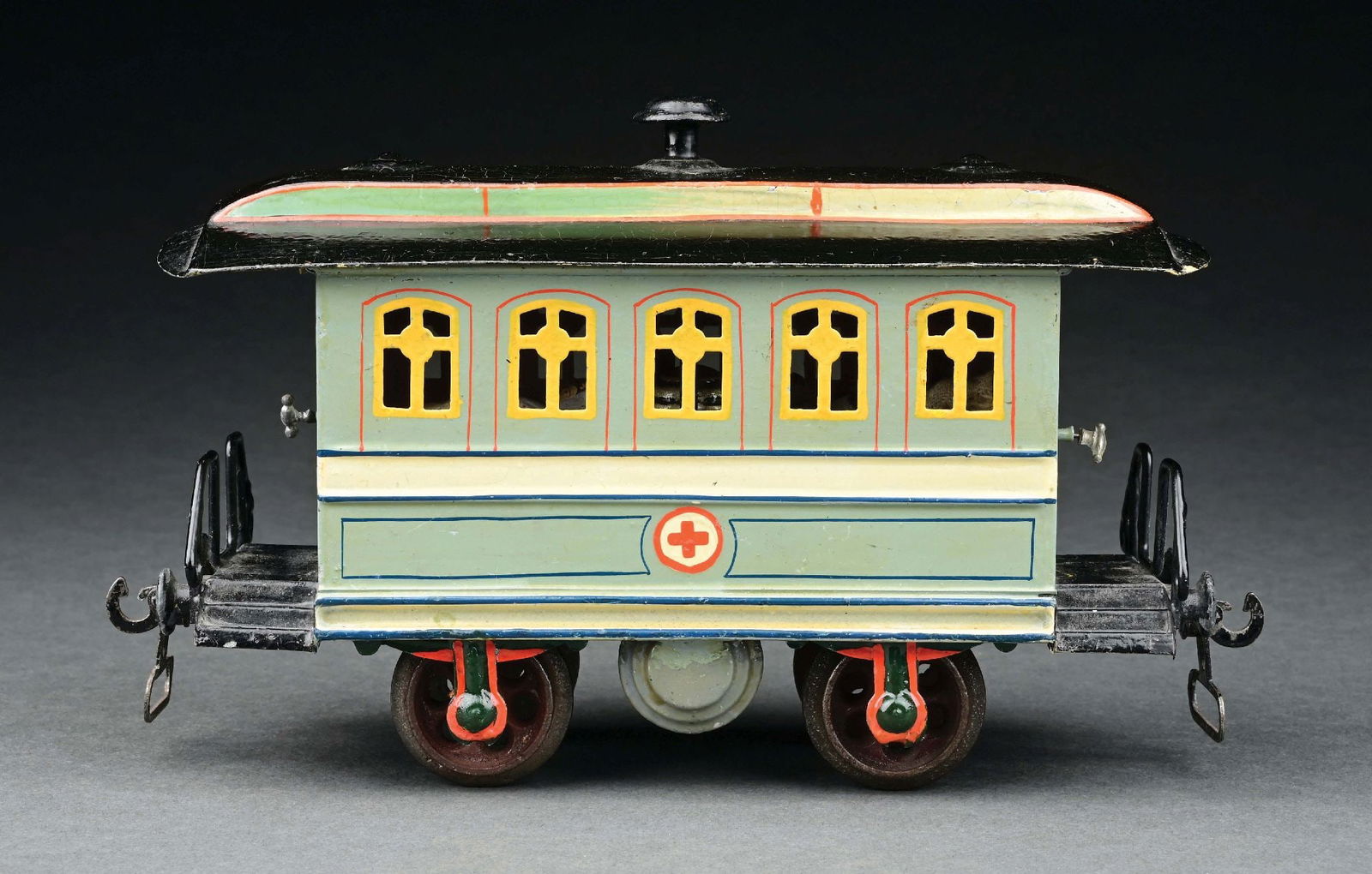 MARKLIN I GA. HAND-PAINTED 4-WHEEL HOSPITAL CAR: C. 1903-1904. With a complete original interior, including stove figures and stretchers. CONDITION: Near mint. Item Dimensions: 8 - 1/2" x 3" x 5 - 1/4".