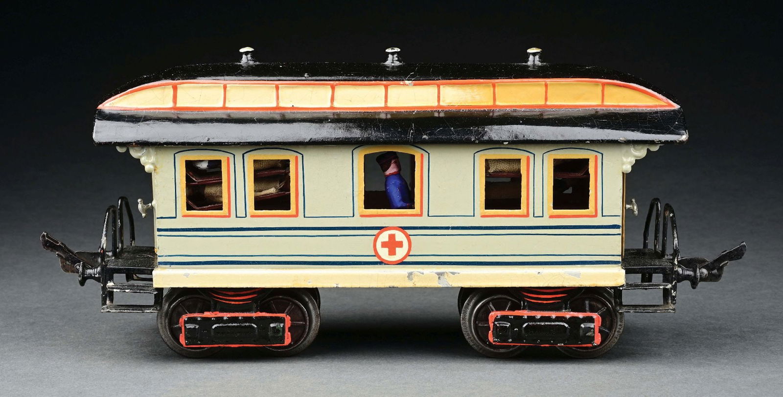 MARKLIN I GA. HAND-PAINTED 8-WHEEL HOSPITAL CAR: C. 1906-1908. Original stove, cabinet, stretchers and figures. CONDITION: Near mint, except minor chips on white lower section of one side. Item Dimensions: 11" x 3" x 5 - 1/2".