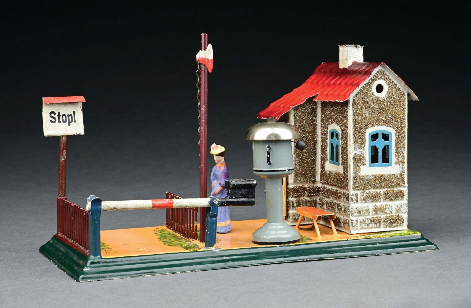 MARKLIN RAILWAY CROSSING GATE WITH GUARD HOUSE AND BELL: With original semaphore, sign and figure. CONDITION: Near mint. Item Dimensions: 9" x 4 - 1/4" x 6".