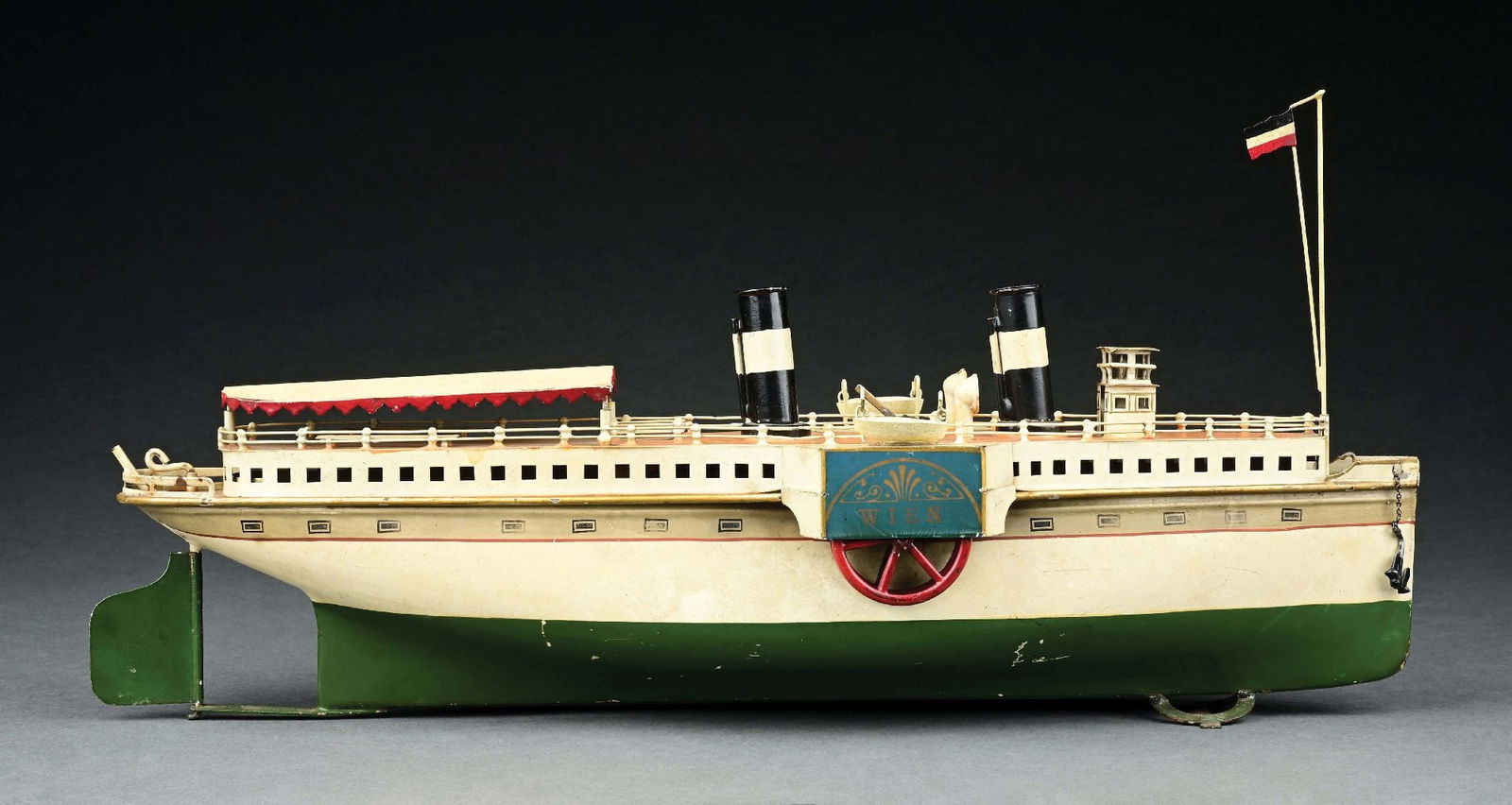MARKLIN CAT. REF. 5066/46 HAND-PAINTED "WIEN" CLOCKWORK POWERED RIVER BOAT: C. 1921-1929. CONDITION: Replacement masts, two stacks, and lifeboats. Could clean to a better grade, excellent condition. Item Dimensions: 18" x 5" x 8 - 3/4".