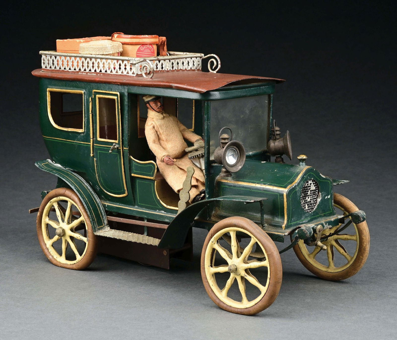MARKLIN CAT. REF. 5214/1 HAND-PAINTED CLOCKWORK-POWERED LIMOUSINE IN GREEN: C. 1909. CONDITION: Includes an original Marklin chauffeur. Retains original rubber tires and lamps. Excellent to near mint condition overall. ILLUSTRATED: Pressland, David. Pressland's Great Book of