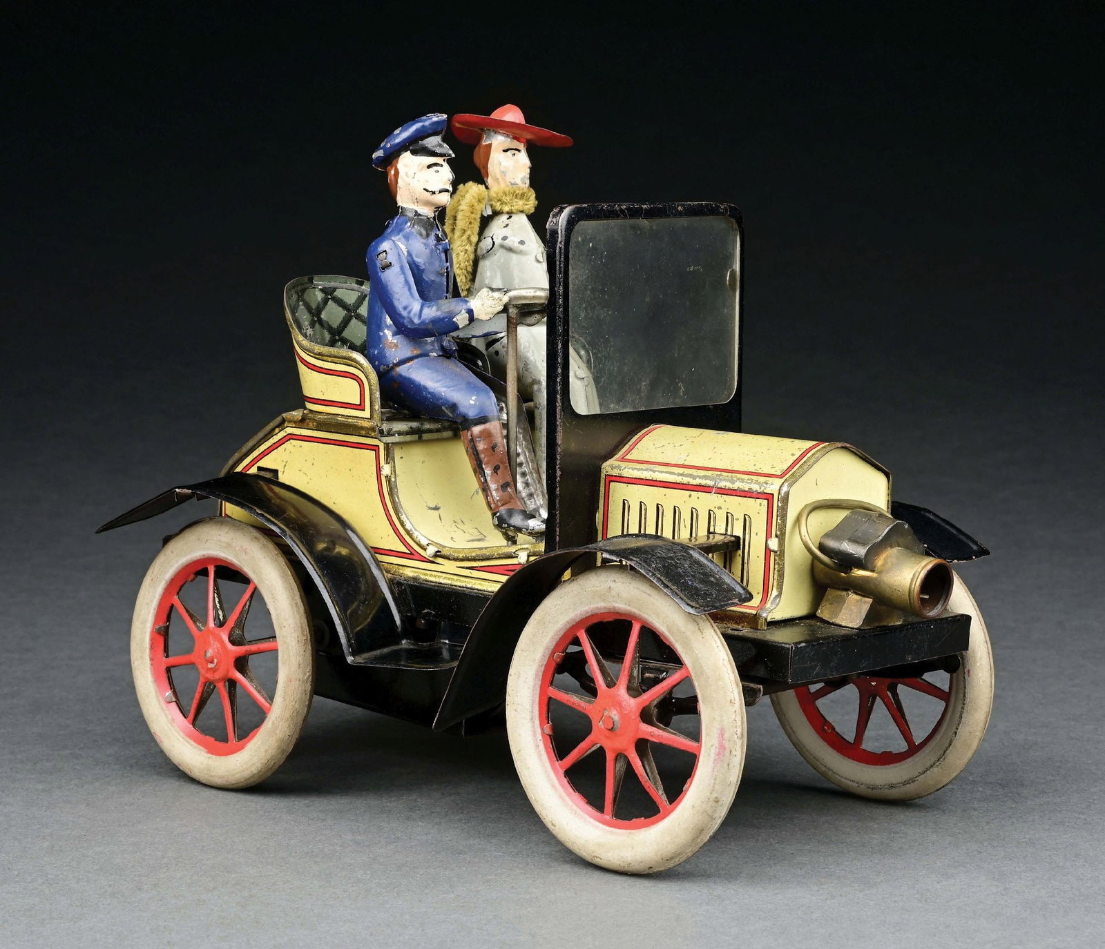 GUNTHERMANN TIN LITHO CLOCKWORK 2-SEAT TOURING CAR W/ HAND-PAINTED FIGURES: CONDITION: Original hand-painted figures including possible original scarf. Overall excellent condition, could possibly clean to a better grade. ILLUSTRATED: Pressland, David. Pressland's Great Book o