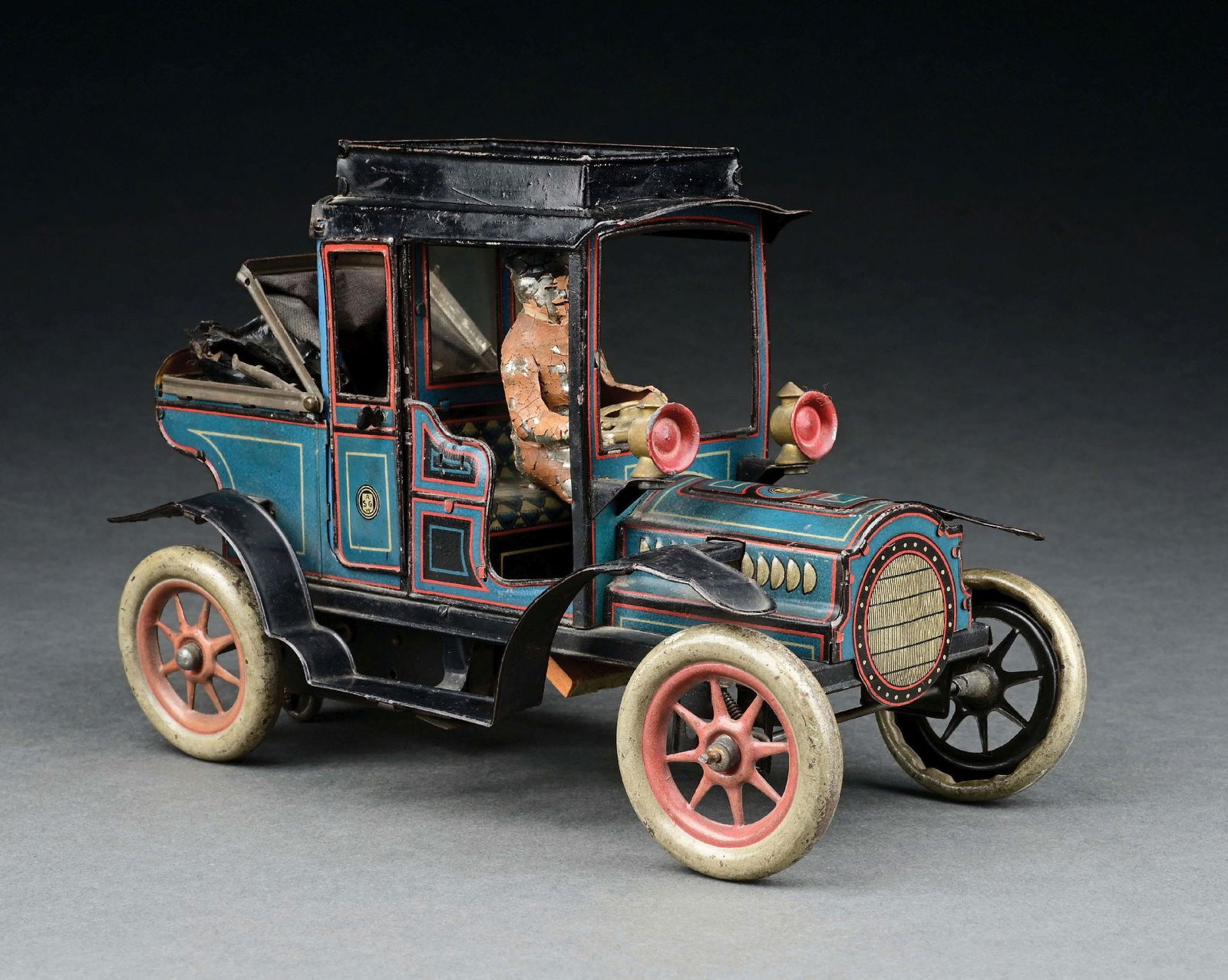 GUNTHERMANN TIN LITHO CONVERTIBLE TOWN CAR W/ HAND-PAINTED DRIVER: CONDITION: Original lights and figure. Convertible roof is tattered, but original. Some paint flaking to driver. Excellent condition overall, could clean to a better grade. Item Dimensions: 9" x 4 - 1