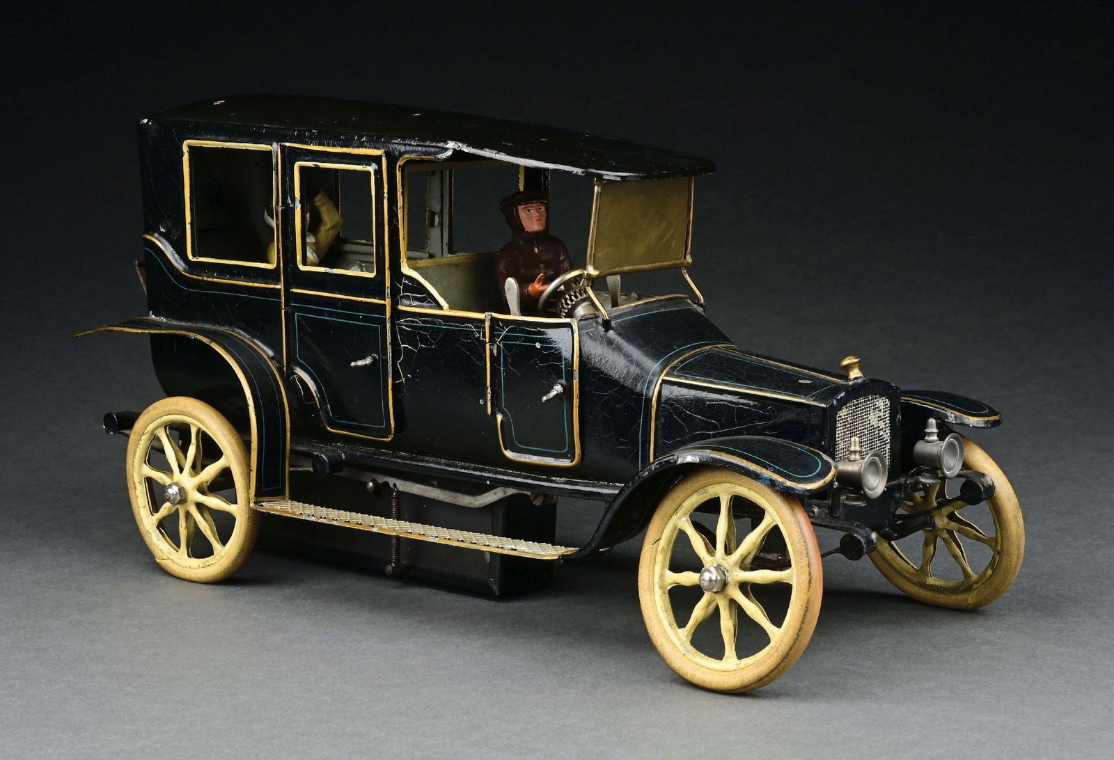 MARKLIN CAT. REF. 5215/1 LIMOUSINE IN DARK BLUE: C. 1914. CONDITION: Retains original tires. Replacement front headlamps. Unknown maker composition driver and passenger. Near mint condition. Item Dimensions: 14" x 5 - 1/4" x 7".