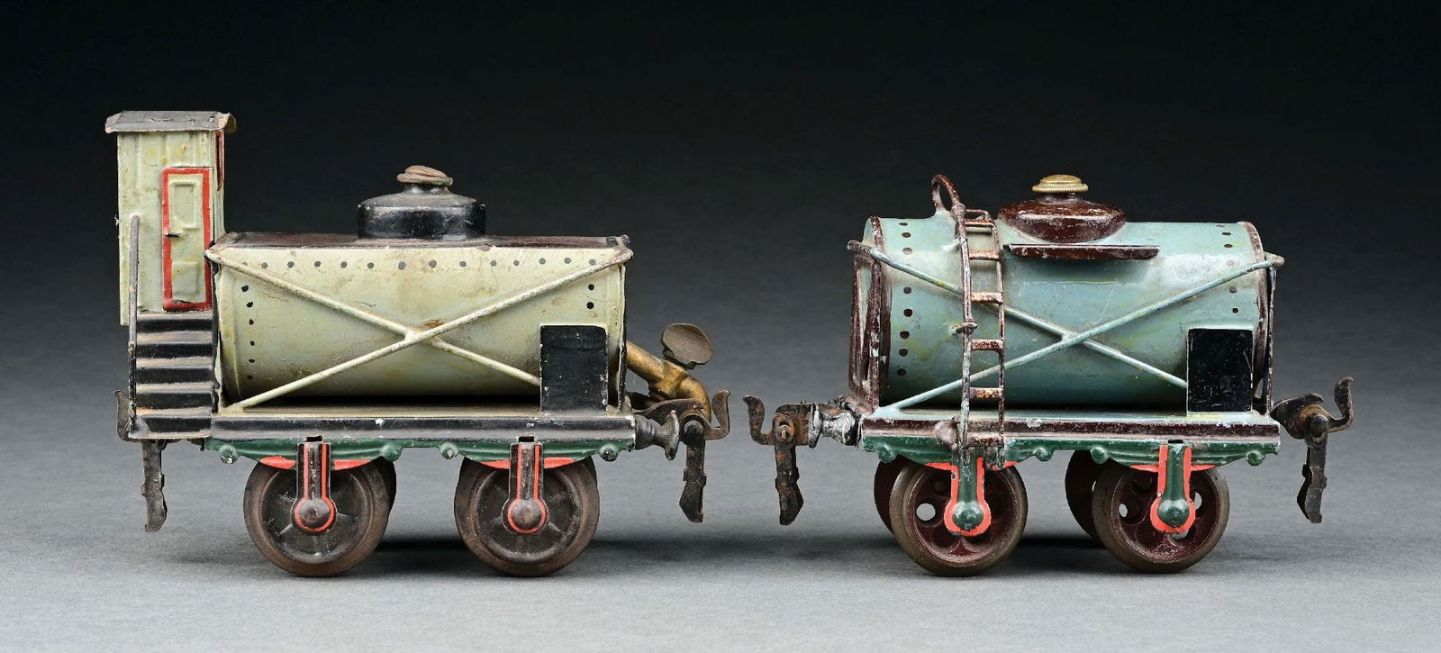 LOT OF 2: MARKLIN HAND-PAINTED 4-WHEEL TANK CAR & TAR WAGON: Tank Car is marked "Standard Oil Company." CONDITION: Both are in excellent condition. Item Dimensions: Largest: 6" x 2 - 1/2" x 5".