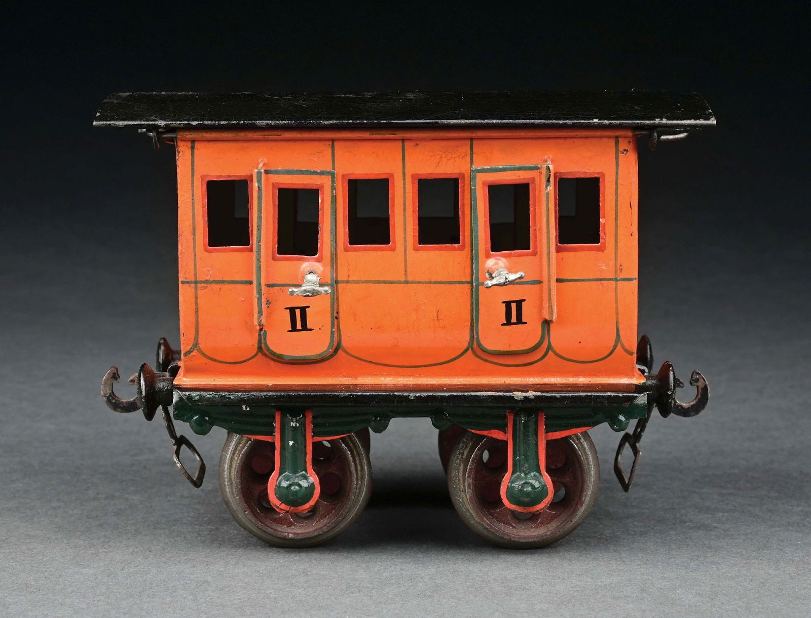 MARKLIN HAND-PAINTED 4-WHEEL DELUXE SECOND CLASS COACH IN ORANGE: C. 1900-1902. CONDITION: Near mint, with the exception of some candle wax on the roof. Item Dimensions: 5 - 1/2" x 3" x 4".