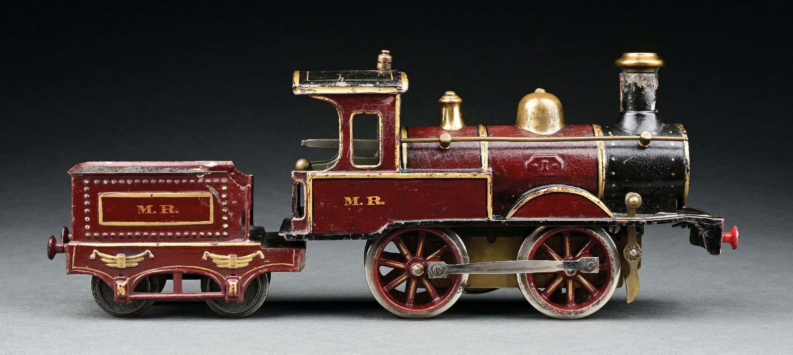 MARKLIN HAND-PAINTED 0-4-0 MIDLAND RAILWAY LOCOMOTIVE & TENDER: C. 1904-1905. CONDITION: Excellent. Missing front coupler and Tender coupler. Item Dimensions: Largest: 9 - 1/2" x 3 - 1/2" x 5 - 1/2".