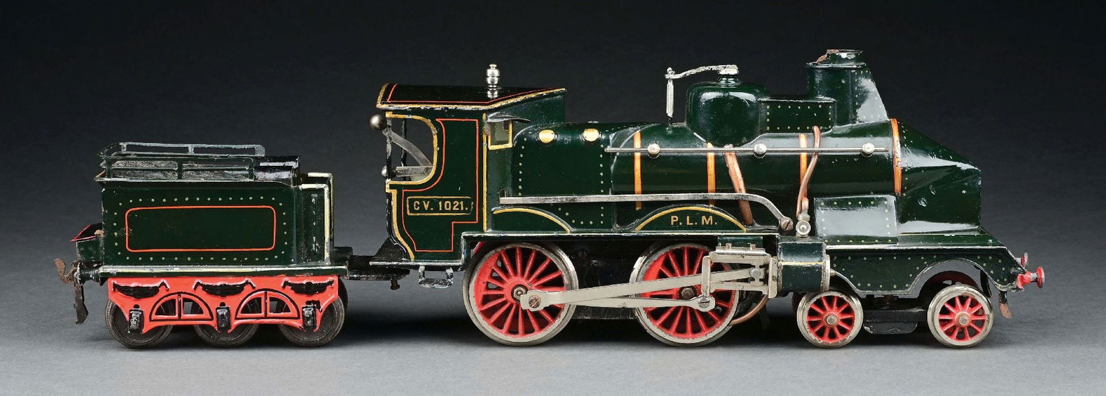 MARKLIN I GA. COUPE VANT LOCOMOTIVE & TENDER: C. 1906-1908. Outstanding example of this French market Locomotive and Tender in green with "PLM" markings. CONDITION: A few minute touch-ups that do not detract in any way. Excellent to near mint con