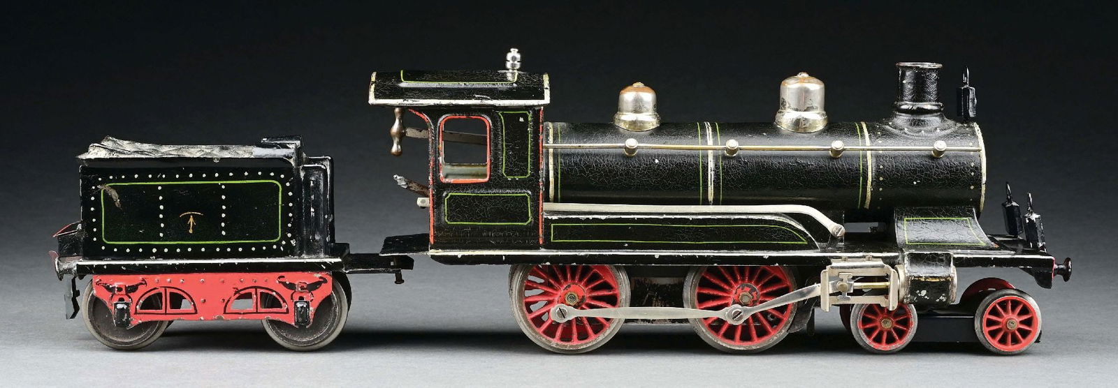 MARKLIN II GA. 4-4-0 EUROPEAN CLOCKWORK LOCOMOTIVE & TENDER: CONDITION: Replacement front trucks and headlamps. Areas of touch-up throughout, which enhances the appearance to excellent condition, but grades very good. Item Dimensions: Largest: 13" x 3 - 1/2" x