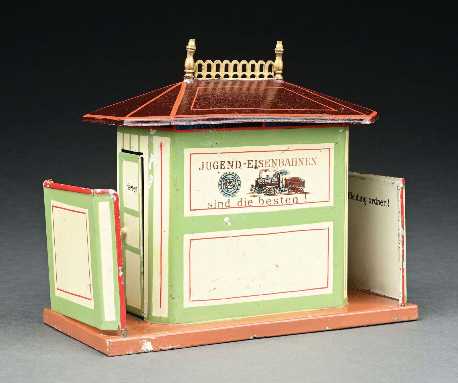 MARKLIN CAT. REF. 2598 HAND-PAINTED WATER CLOSET: German inscriptions. CONDITION: Retains original walls. Excellent to near mint condition. Item Dimensions: 7 - 1/2" x 3 - 1/2" x 6".