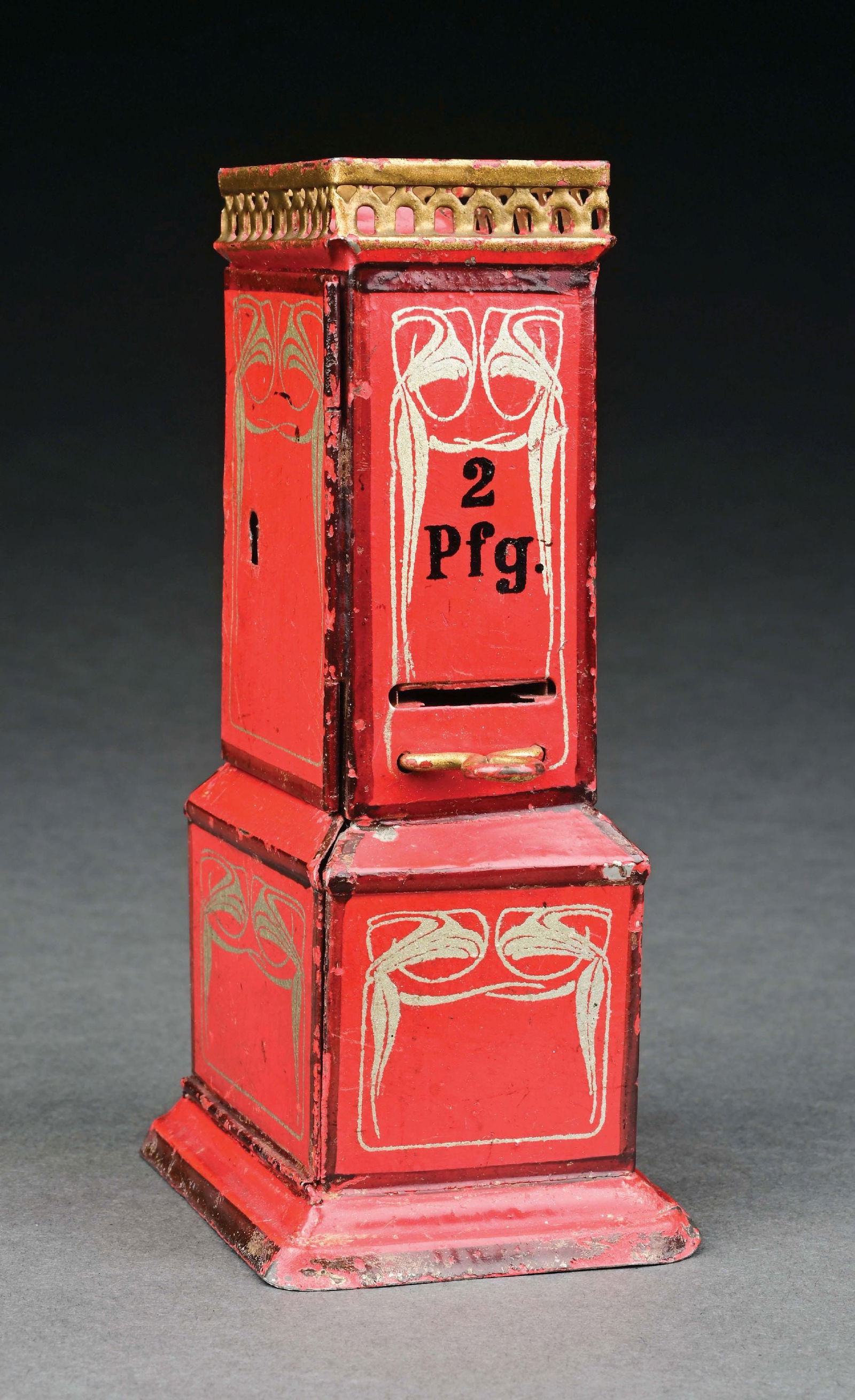 MARKLIN CAT. REF. 2196 HAND-PAINTED TICKET DISPENSER IN RED: C. 1904-1909. CONDITION: Excellent overall condition. Item Dimensions: 3" x 2 - 3/8" x 5 - 1/2".