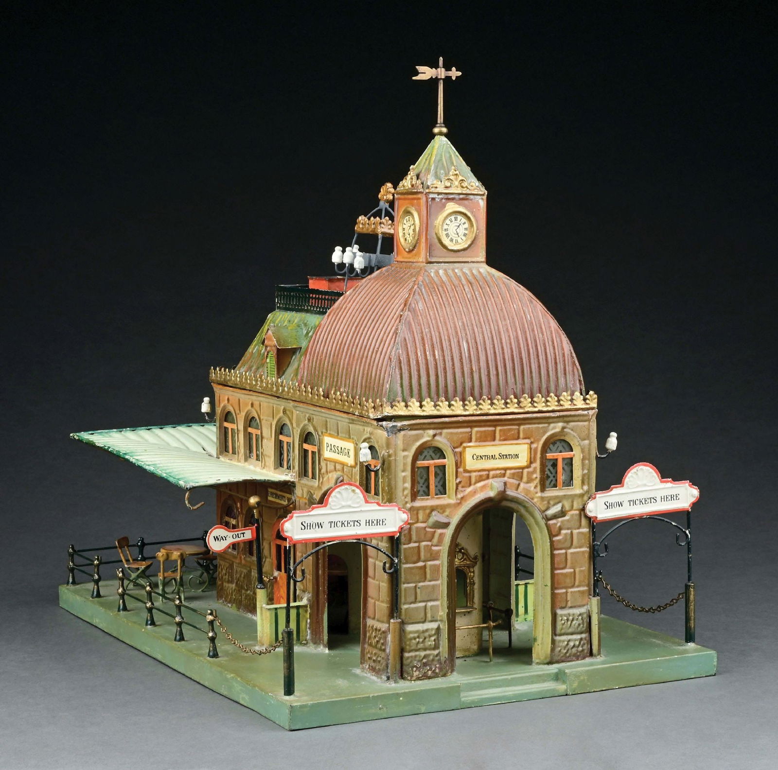 MARKLIN HAND PAINTED CAFE STATION: With english inscriptions. Fence and railings are replaced. One of the "way out" signs has been replaced. CONDITION: Areas of restoration to base. Item Dimensions: 16 - 1/2" x 12" x 15 - 1/2".