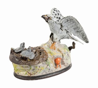 EAGLE AND EAGLETS CAST IRON MECHANICAL BANK