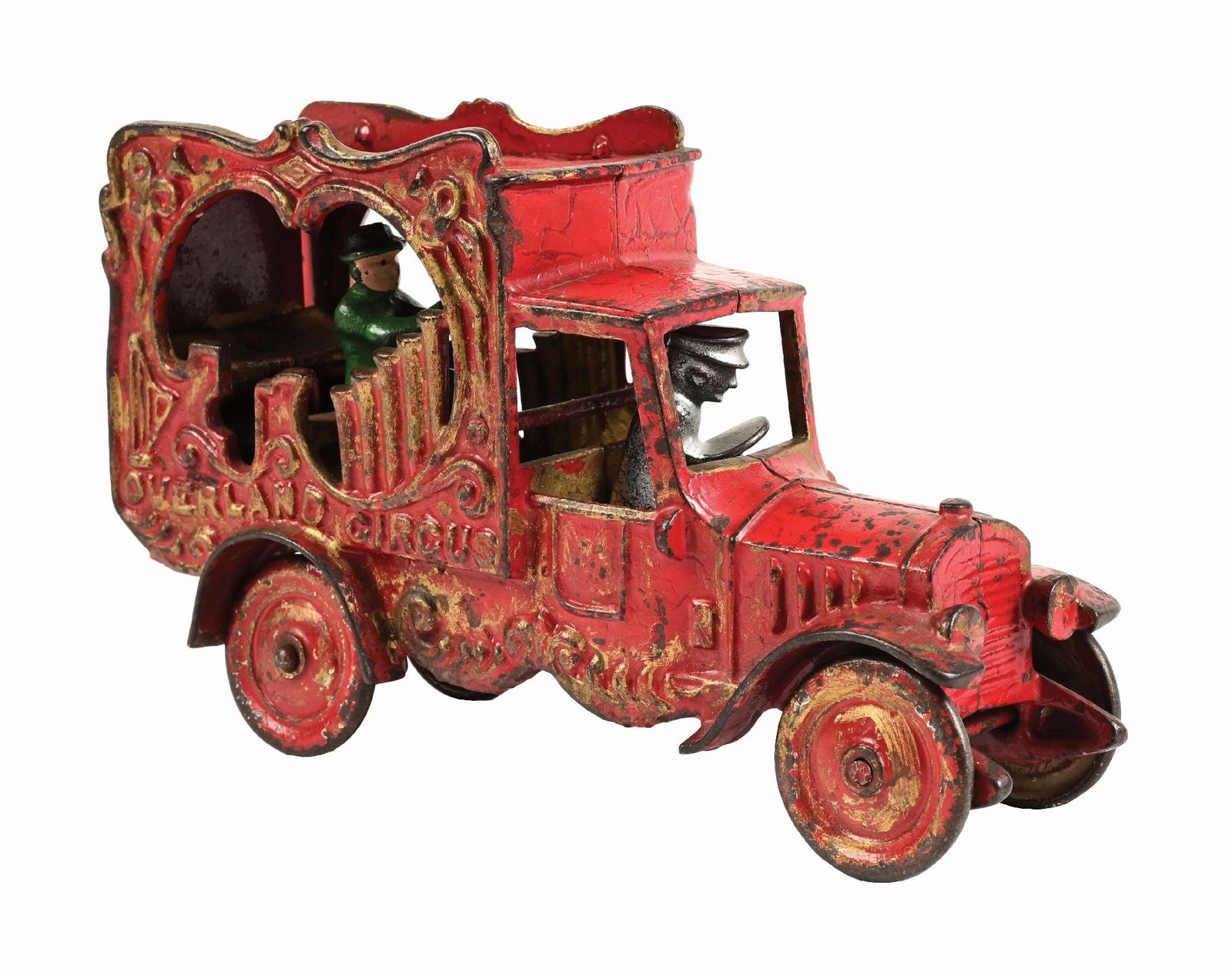CAST IRON AMERICAN-MADE OVERLAND CIRCUS TRUCK: Embossed "Overland Circus" on both sides of rear of truck. Disc wheels. CONDITION: Has driver and rear figure. Moderate paint loss and wear. Condition: (Very Good). Dimensions: 9" x 3" x 5 - 1/4"
