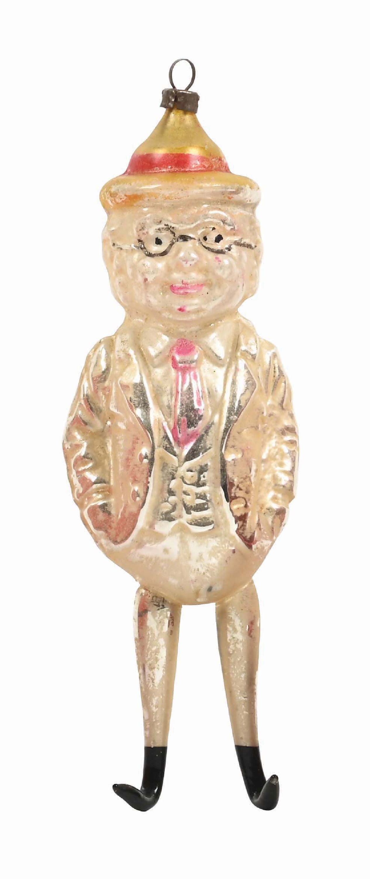 LOT OF 2: SANTA ROLY POLY AND BISQUE DOLL HEAD CANDY CONTAINER: Paper Mache Santa Roly Poly marked Germany, circa 1915 and a German bisque doll head candy container ornament. Both in very good condition. Condition: (Very Good) Dimensions: Largest: 5 - 3/4" T. CORR