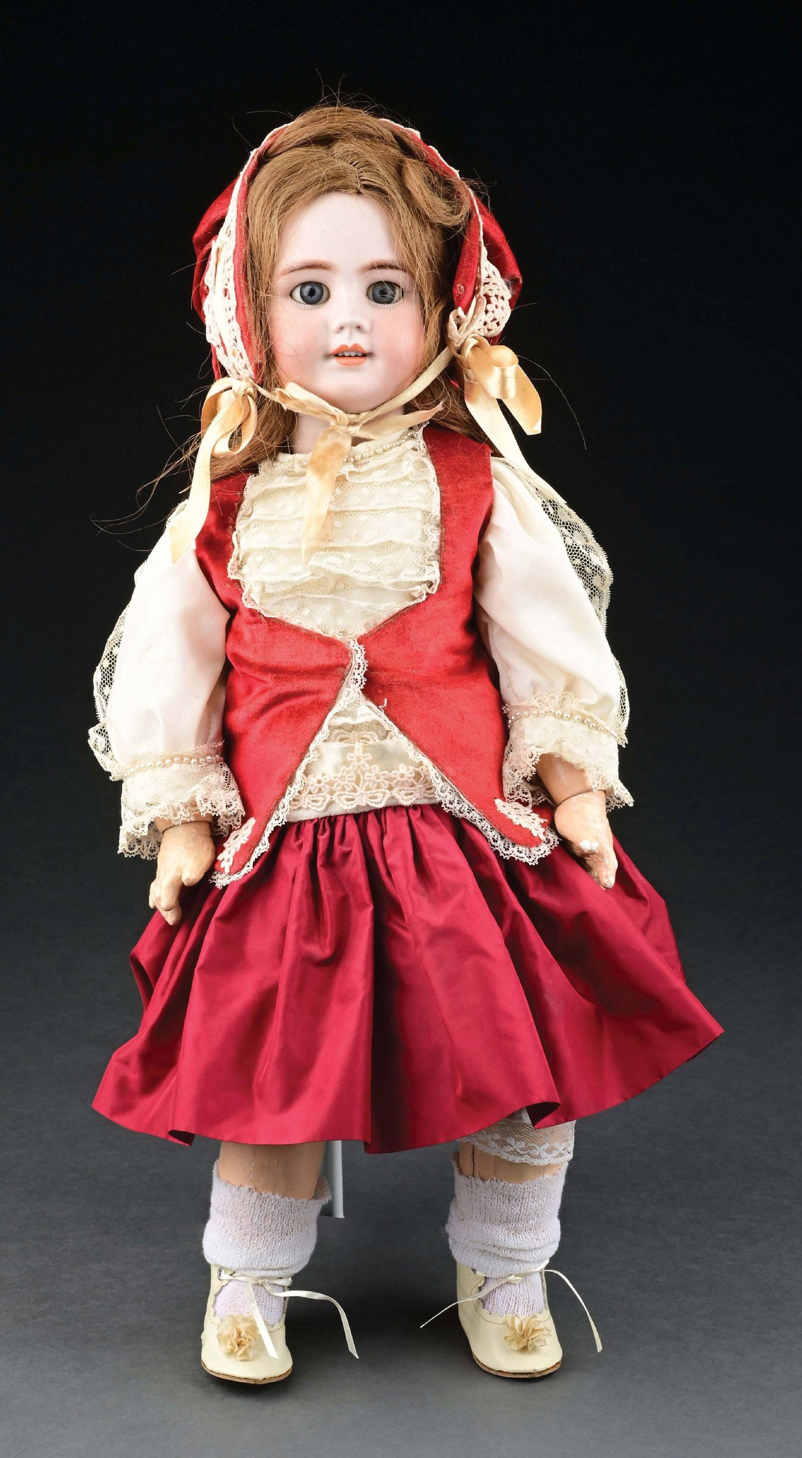 EARLY 20TH CENTURY BISQUE HEAD DOLL INCISED "D. E. P. 10": This doll is the standard collaboration between the German form of Simon & Halbig and French manufacturer Jumeau. She has a bisque socket head, which is marked as in the title, with an additional red