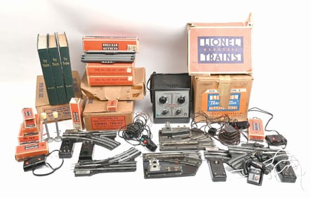 LARGE LOT OF LIONEL TRAIN TRANSFORMERS, SWITCHES AND BOOKS