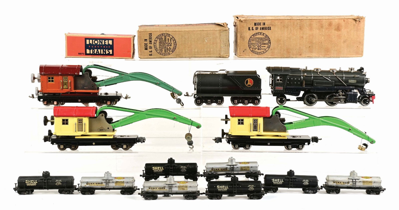 LOT OF 4: PRE & POST-WAR TRAINS: (A) A No. 260T repaired steam chest in gunmetal grey, one Locomotive flag and other numerous parts replaced, which you might consider it restored. It has a nice visual box and restored No. 260T Tender