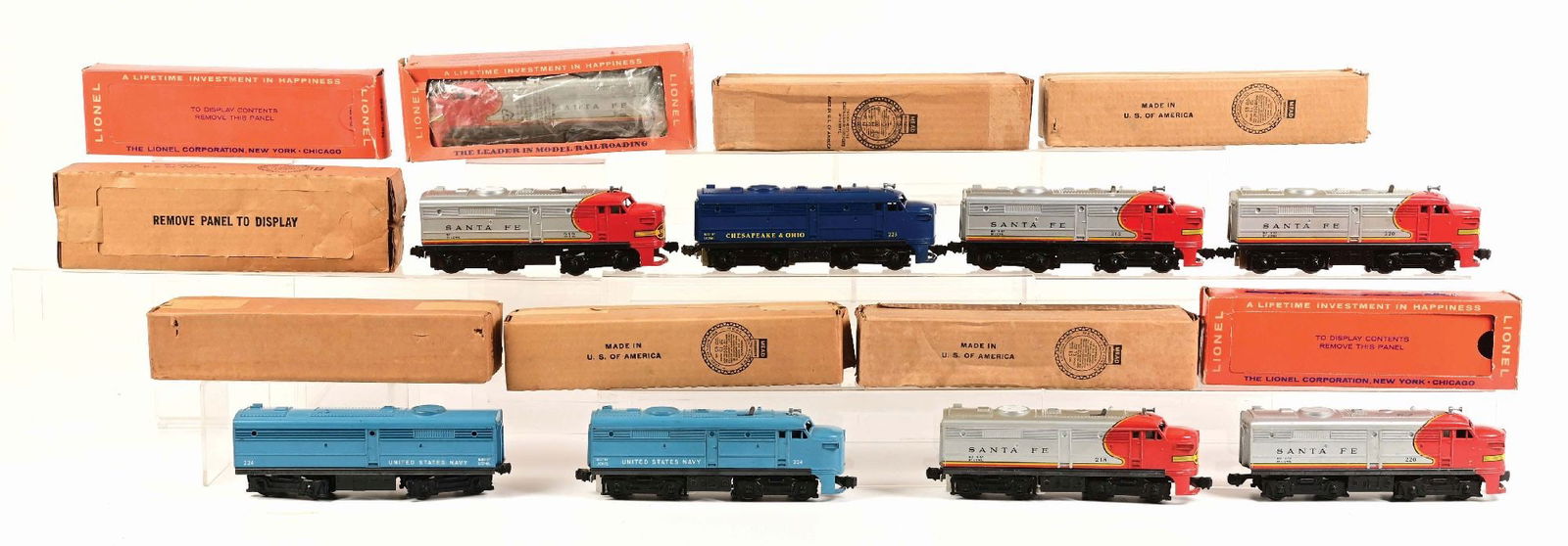 LOT OF 9: LIONEL ALCO LOCOMOTIVES: (A) A complete No. 212 Alco Locomotive, excellent condition. There is some rust on the power wheels. (B) A No. 215 Alco Locomotive, which has a cracked coupler support bar, otherwise in excellent cond