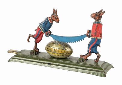 GERMAN TIN LITHO RABBIT SAWING EGG PENNY TOY