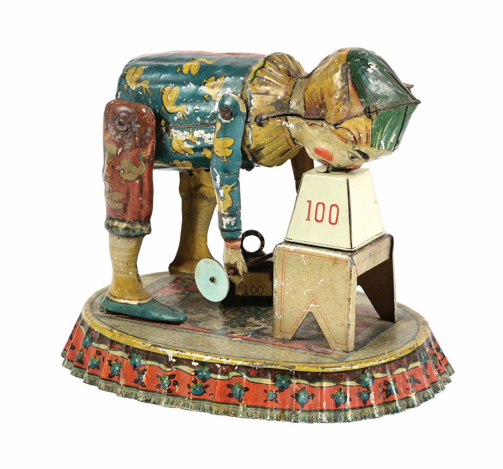 GERMAN TIN LITHO FISCHER WIND-UP WEIGHTLIFTING CLOWN: Pre-war. A nice tin litho. When wound, clown who is lifting weights in his arms bends down to pick up weight with his teeth, comes up and goes back down again. The toy is working, but works sporadical