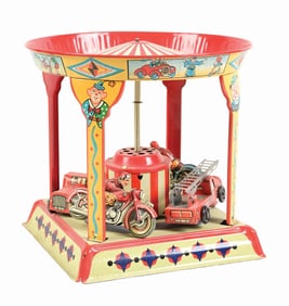 GERMAN TIN WIND- UP MOTORCYCLE AND FIRE TRUCK CAROUSEL