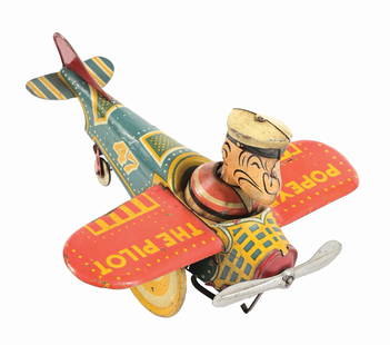 MARX TIN LITHO WIND-UP POPEYE THE PILOT AIRPLANE TOY: 1936 version. Marked "47" on fuselage. CONDITION: Original pipe, front propeller and tail. Some moderate scratching and wear throughout. Some bending to wings. Condition: (Very Good). Dimensions: 8 -