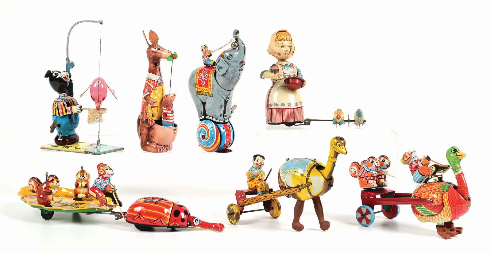 LOT OF 7: JAPANESE TIN LITHO WIND-UP TPS ANIMAL & HUMAN TOYS: (A) Woman Feeding Chicks. (B) Man Riding Elephant. (C) Kangaroo and Joey. (D) Bear Fishing. (E) Monkey Riding with Squirrels. (F) Two Ostrich-Drawn toys. Condition: (Very Good - Excellent). Dimensions