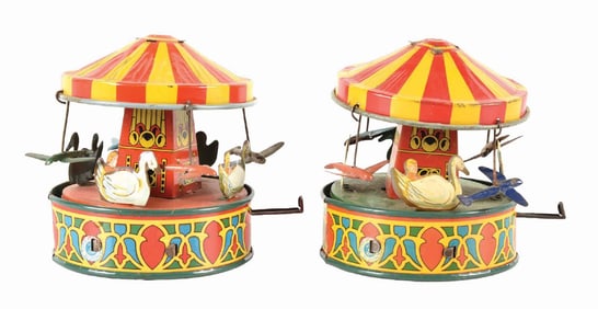 LOT OF 2: LEVER ACTION WYANDOTTE TIN LITHO MERRY-GO-ROUNDS